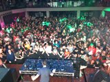 Nightclub Crowd Excited for DJ Performance
