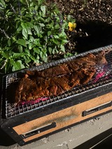 Outdoor Grilling: Fresh Ribs Cooking Over Hot Coals