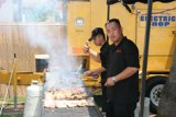 Man Barbecuing with His Wristwatch On