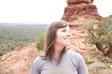 Woman Smiling Among Sedona's Red Rock Formations