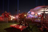 Spectacular Light Show and Wooden Bench at Coachella Carnival