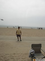 Walking on the Beach with a Helicopter and a Chair