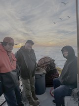 Crab Fishermen at Sea During Dawn