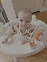 Happy Baby Playing in Activity Walker
