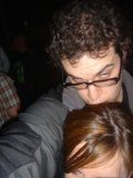 Curly-Haired Man at the Club