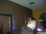 Ponytailed Man Peeking Out from Closet