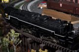 Black Locomotive Amongst Other Trains at Train Museum