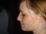 Side Profile Portrait of Woman in Dark Setting