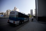 Tour Bus in the Urban Metropolis