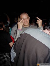 Partygoer with Upraised Hands