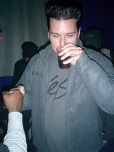 Two Men Enjoying Drinks Together