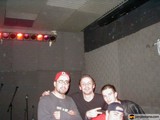 Three Men Strike a Pose on Stage