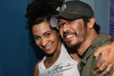 Smiling Couple Showing Off Their Tattoos