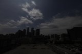 Bright Sun Shimmers over City Skyline