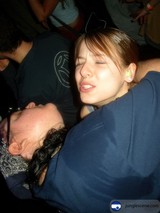 Two Women Embrace at a Nightclub
