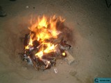 Flames and Embers Dance in the Sand