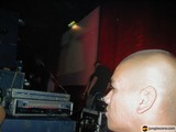 DJ Performance in Front of a Lively Crowd