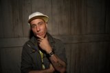Tattooed Man with a Hat