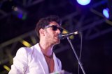 Spotlight on the White Suit Singer