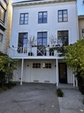 White Urban House with Balcony
