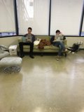 Two Teenage Boys Engrossed in Their Work on a Sunny Afternoon