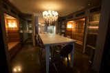 Elegant Dining Room with Chandelier and Hardwood Table