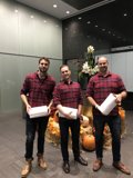 Three Men With Flower Arrangements