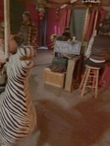 Woman in Striped Shirt at Indian Street Food Stall