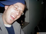 The Smiling Man with Glasses and a Hat