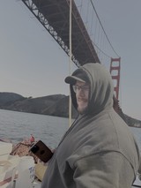Tourist Enjoying Golden Gate Bridge View from Boat