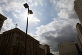 City Street Light Under Cloudy Sky