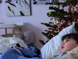 Child Gazing at Christmas Tree on Winter Morning