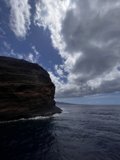 Serene Ocean View under Cloudy Sky