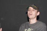 Man in Camo and Two Hats