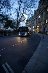 White Cement Truck on London Street at Dusk