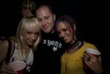 Three Happy Party-Goers Pose for the Camera