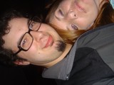 Two Friends Share a Playful Close-Up Selfie