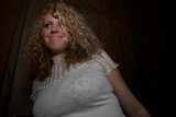 Curly-Haired Lady in Formal Blouse