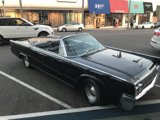 Sleek Convertible Parked in Busy Lot