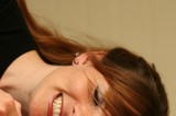 Joyful Portrait of Young Woman with Auburn Hair