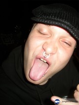 A Man with a Tongue Out and a Beanie Hat
