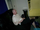 Bald Man Lounging on a Cozy Couch