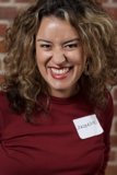 Curly-haired woman with a smile