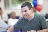 Smiling Man with Glasses