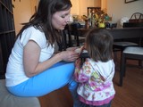 Mother and Toddler Sharing a Snack at Home