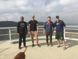 Four Men and a Dog Enjoying the View
