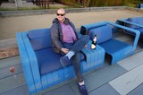 Relaxing on Blue Outdoor Furniture with Champagne