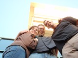 Three Friends Posing from a Worm's Eye View