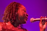 Center Stage: A Talented Woman Belting Out Her Tunes