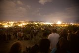 Fireworks Ignite the Night Sky Above a Crowded Plaza